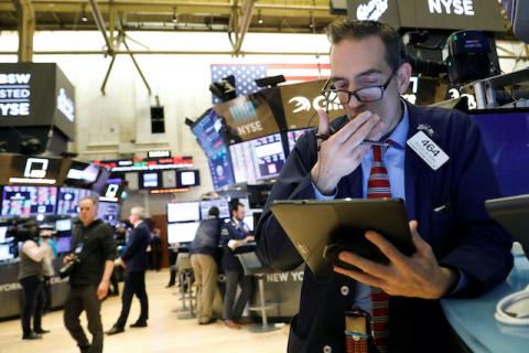 Traders work on the floor at the New York Stock Exchange (NYSE) in New York, U.S., February 27, 2020. PHOTO BY REUTERS/Brendan McDermid