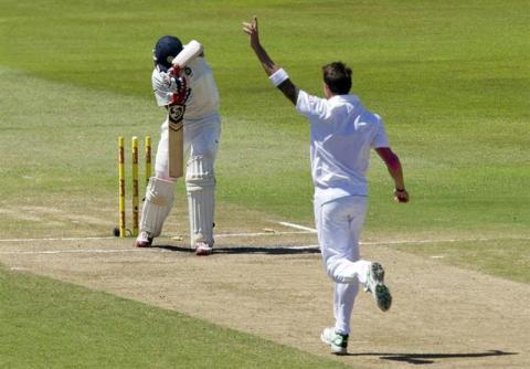 South Africa's Dale Steyn celebrates bowling India's Cheteshwar Pujara during the fifth day of the second cricket test match in Durban