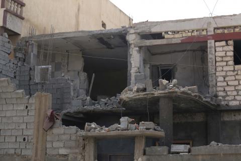 Damage to a house is seen following clashes between rival militias in the Janzour district on the outskirts of Tripoli