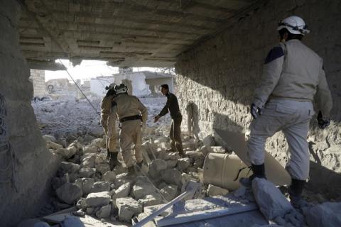 Civil defence members inspect damage after what activists said were airstrikes carried out by the Russian air force in Khan al-Sebil, southern Idlib countryside, Syria, December 30, 2015. PHOTO BY REUTERS/Khalil Ashawi