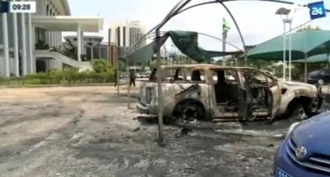 A still image from video of a fire damaged vehicle outside the national assembly building in Libreville, Gabon, September 2, 2016. PHOTO BY REUTERS/GABON 24 TV