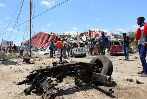 Somalis inspect the damage caused at the scene of an attack on an Italian military convoy in Mogadishu, Somalia, September 30, 2019. PHOTO BY REUTERS/Feisal Omar