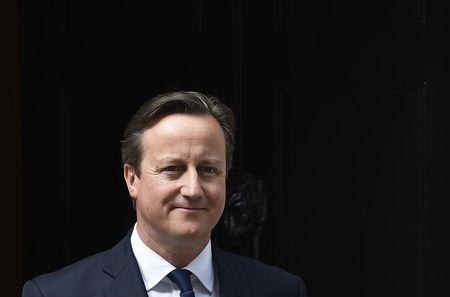 Britain's Prime Minister David Cameron waits to greet his Ukrainian counterpart Arseniy Yatsenyuk at Number 10 Downing Street in London, Britain, July 15, 2015. PHOTO BY REUTERS/Toby Melville