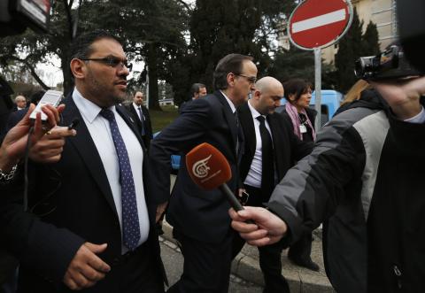 Members of the Syrian opposition delegation Anas al-Abdah (L) and Hadi al-Bahra (C) speak to journalists as they arrive for their first meeting face-to-face with Syrian government delegation and the U.N.-Arab League envoy