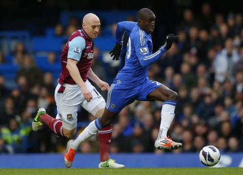 Demba Ba of Chelsea (R) is chased by James Collins of West Ham during their English Premier League soccer match