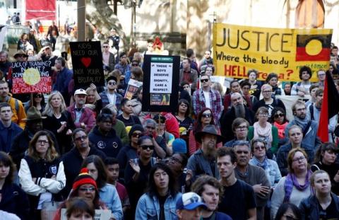 Demonstrators gather outside Sydney's Town Hall to protest against alleged child abuse in Australia's Northern Territory detention centers, July 30, 2016. PHOTO BY REUTERS/Jason Reed