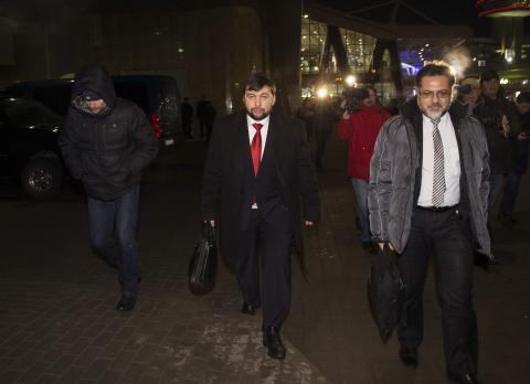 Denis Pushilin (C), representative of the separatist self-proclaimed Donetsk People's Republic and Vladislav Deinego (R) representative of the Luhansk republic walk before leaving Belarus at Minsk's International airport, January 16, 2015. PHOTO BY REUTERS/Vasily Fedosenko