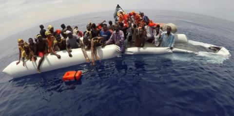 Migrants on a dinghy are rescued by "Save the Children" NGO crew from the ship Vos Hestia in the Mediterranean sea off Libya coast, June 17, 2017. PHOTO BY REUTERS/Stefano Rellandini