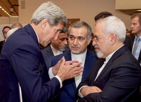 U.S. Secretary of State John Kerry (L) speaks with Hossein Fereydoun (C), the brother of Iranian President Hassan Rouhani, and Iranian Foreign Minister Javad Zarif (R), before the Secretary and Foreign Minister addressed an international press corps gathered at the Austria Center in Vienna, Austria, July 14, 2015. PHOTO BY REUTERS/US State Department