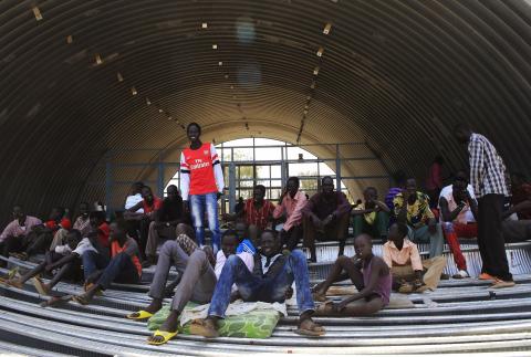 Families displaced by recent fighting in South Sudan, camp in a warehouse inside the United Nations Mission in Sudan (UNAMIS) facility in Jabel, on the outskirts of capital Juba