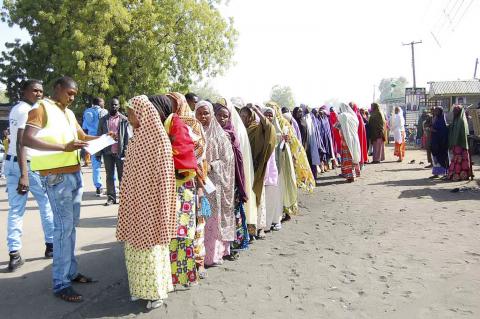 Displaced people fleeing from violence wait in line to receive relief materials at a camp for displaced people camp in Borno State, January 19, 2015. PHOTO BY REUTERS/Stringer