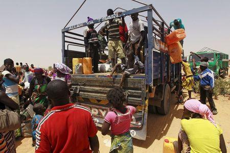 People displaced by the Boko Haram insurgence board a truck to travel back to their home states, after arriving in Nigeria, at Geidam, Nigeria, May 6, 2015. PHOTO BY REUTERS/Afolabi Sotunde