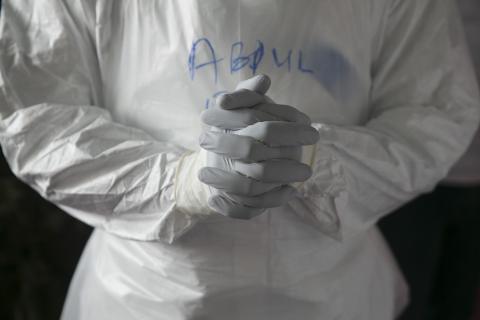 A Sierra Leonean doctor practises wearing protective clothing in the Ebola Training Academy in Freetown, Sierra Leone, December 16, 2014. PHOTO BY REUTERS/Baz Ratner