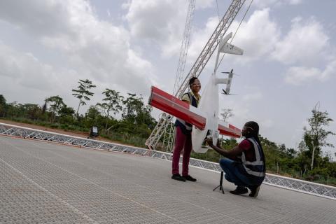 Workers pack a box of vaccines to be delivered by a Zipline drone, in Ghana April 22, 2019. Zipline drones, supported by Gavi and the UPS Foundation, cut the time taken to deliver lifesaving medical supplies from hours to minutes. PHOTO BY REUTERS/Tony Noel 