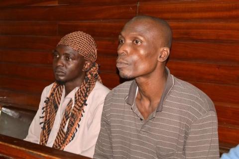 Members of secessionist group Mombasa Republican Council (MRC), Jabiri Ali Dzuya (L) and Bwana Mkuu Alwan (R) sit inside the dock at the High Court in Kenya's coastal city Mombasa, July 29, 2016, where they were sentenced to death for murdering four police officers on the eve of national elections in 2013. PHOTO BY REUTERS/Joseph Okanga