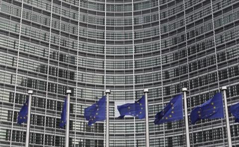 European Union flags are seen outside the European Commission headquarters in Brussels ahead of an EU heads of state summit