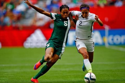 United States forward Sydney Leroux (2) and Nigeria defender Onome Ebi (5) battles for the ball during the second half in a Group D soccer match in the 2015 FIFA women's World Cup at BC Place Stadium. PHOTO BY REUTERS/Michael Chow-USA TODAY Sports