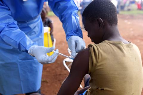 A Congolese health worker administers Ebola vaccine to a boy who had contact with an Ebola sufferer in the village of Mangina in North Kivu province of the Democratic Republic of Congo, August 18, 2018. REUTERS/Olivia Acland