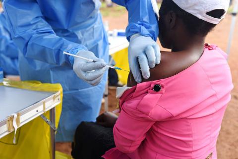 A Congolese health worker administers Ebola vaccine to a woman who had contact with an Ebola sufferer in the village of Mangina in North Kivu province of the Democratic Republic of Congo, August 18, 2018. PHOTO BY REUTERS/Olivia Acland