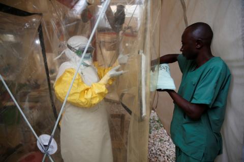 A health worker wearing Ebola protection gear enters the Biosecure Emergency Care Unit (CUBE) at the ALIMA (The Alliance for International Medical Action) Ebola treatment centre in Beni, in the Democratic Republic of Congo, March 30, 2019. PHOTO BY REUTERS/Baz Ratner