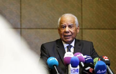 Egypt's Prime Minister Hazem el-Beblawi speaks during a news conference in Abu Dhabi