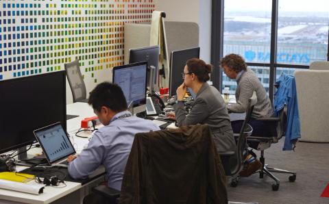 UBS employees work in the UBS "fintech lab" at Canary Wharf in London, Britain, October 19, 2016. PHOTO BY REUTERS/Hannah McKay