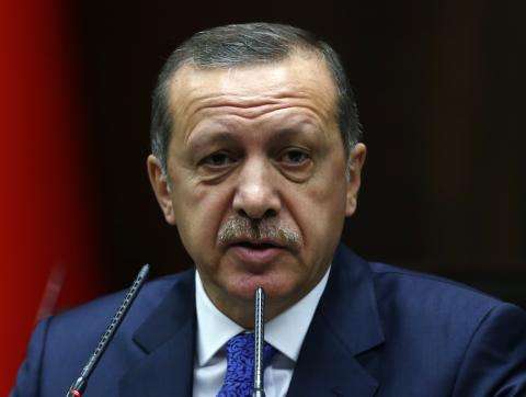 Turkey's Prime Minister Tayyip Erdogan addresses members of parliament from his ruling AK Party (AKP) during a meeting at the Turkish parliament in Ankara