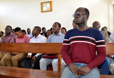 Tanzanian investigative journalist Erick Kabendera sits inside the Kisutu Residents Magistrate Court in Dar es Salaam, Tanzania, August 5, 2019. PHOTO BY REUTERS/Emmanuel Herman