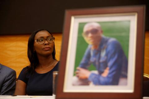 Esther Kabau-Wanyoike the sister of Kenyan George Kabau who died in the Ethiopian Airlines crash sit next to his picture during a news conference where her lawyers announced they plan to file a wrongful-death lawsuit against Boeing, at the Serene hotel in Nairobi, Kenya, April 16, 2019. PHOTO BY REUTERS/Baz Ratner