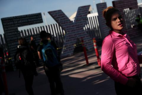 Evelyn Alexandra Salguero from Guatemala, part of a caravan of thousands from Central America tying to reach the United States, waits for her number in order to seek asylum at the Chaparral border crossing in Tijuana, Mexico, January 25, 2019. PHOTO BY REUTERS/Shannon Stapleton