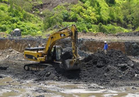 An excavator is used at the bottom of Congolese state mining company Gecamines' Kamfundwa open pit copper mine, January 31, 2013. PHOTO BY REUTERS/Jonny Hogg