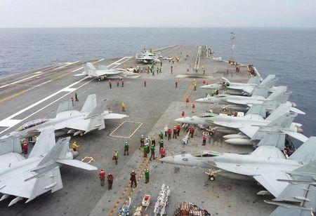 U.S. Navy FA-18 Hornets park on the flight deck of the USS George Washington during the Annual Exercise 2013, at sea, November 28, 2013. PHOTO BY REUTERS/Kyodo