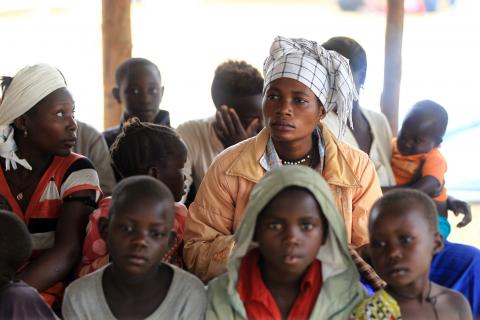 Congolese family, who migrated from Democratic Republic of Congo by fleeing on a boat across Lake Albert, waits to be registered by United Nations High Commission for Refugees (UNHCR) in Ntoroko, Uganda, February 17, 2018. PHOTO BY REUTERS/James Akena