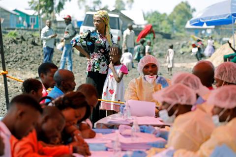 A woman and child wait to receive the Ebola vaccination in Goma, Democratic Republic of Congo, August 5, 2019. PHOTO BY REUTERS/Baz Ratner