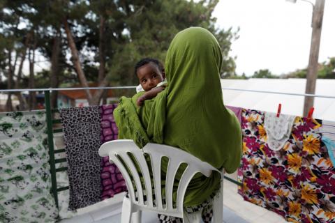 Farhiya, 23, from Somalia holds her one month old daughter Raya, at the Open Solidarity Refugee Camp in Lebos, Greece, June 8, 2017. PHOTO BY REUTERS/Zohra Bensemra 