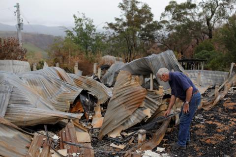 Farmer Jeff McCole, 70, looks through the remains of his family home destroyed by bushfire during an interview with Reuters in Buchan, Victoria, Australia, January 23, 2020. PHOTO BY REUTERS/Andrew Kelly