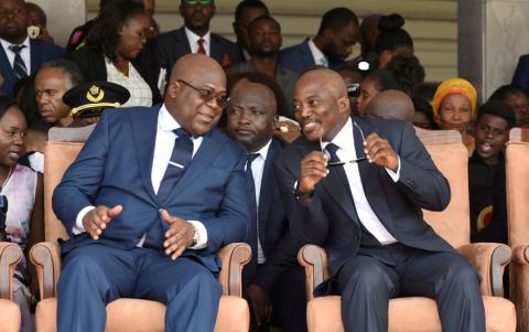 Democratic Republic of Congo's outgoing President Joseph Kabila sits next to his successor Felix Tshisekedi during an inauguration ceremony whereby Tshisekedi will be sworn into office as the new president, January 24, 2019. PHOTO BY REUTERS/Olivia Acland