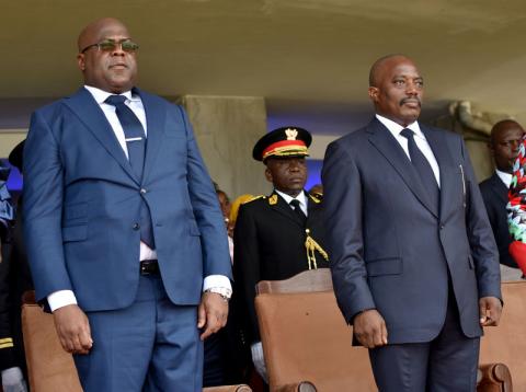 Democratic Republic of Congo's outgoing President Joseph Kabila and his successor Felix Tshisekedi stand during an inauguration ceremony whereby Tshisekedi will be sworn into office as the new president of the Democratic Republic of Congo at the Palais de la Nation in Kinshasa, Democratic Republic of Congo, January 24, 2019. PHOTO BY REUTERS/ Olivia Acland