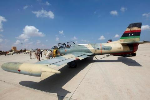 Members of Libyan forces allied with the UN-backed government prepare a renovated Libyan fighter jet at Misurata air base, Libya, September 4, 2016. PHOTO BY REUTERS/Ismail Zitouny