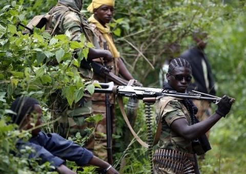 A Seleka fighter holds his machine gun near the town of Kuango, close to the border with Democratic Republic of Congo, June 9, 2014. PHOTO BY REUTERS/Goran Tomasevic