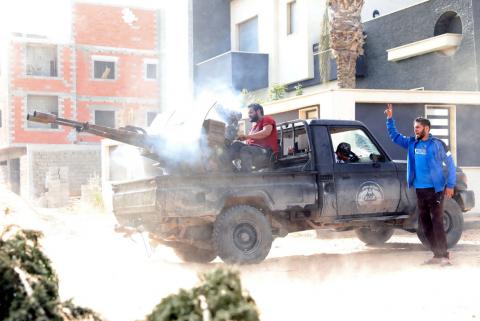 A member of the Libyan internationally recognised government forces fires during a fight with Eastern forces in Ain Zara, Tripoli, Libya, April 25, 2019. PHOTO BY REUTERS/Hani Amara