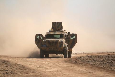 Syrian Democratic Forces(SDF) fighters ride a military vehicle north of Raqqa city, Syria, March 8, 2017. PHOTO BY REUTERS/Rodi Said