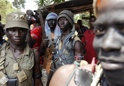 Fighters from the Christian "anti-balaka" militia stand at the headquarters in the northern Bangui suburb of Boeing, an area near the Mpoko International Airport of Bangui