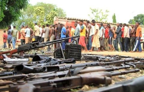 Suspected fighters are paraded before the media by Burundian police near a recovered cache of weapons after clashes in the capital Bujumbura, Burundi, December 12, 2015. PHOTO BY REUTERS/Jean Pierre Aime Harerimana