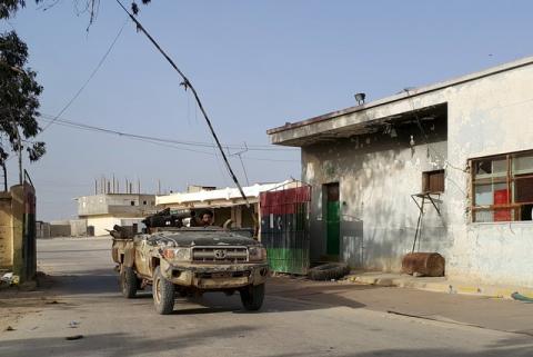 Forces loyal to Libya's eastern government sit inside a vehicle mounted with a weapon during clashes with the Shura Council of Libyan Revolutionaries in Benghazi, Libya, April 19, 2016. PHOTO BY REUTERS/Stringer