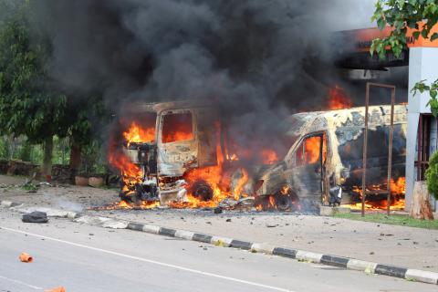 An ambulance and a fire engine set on fire by a Shi'ite group. PHOTO BY REUTERS/Afolabi Sotunde