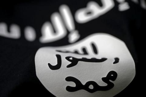 An Islamic State flag is seen in this picture illustration taken February 18, 2016. PHOTO BY REUTERS/Dado Ruvic/Illustration