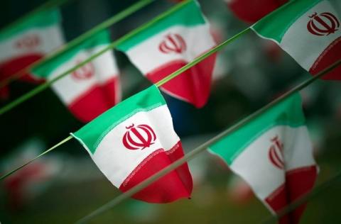 Iran's national flags are seen on a square in Tehran, February 10, 2012. PHOTO BY REUTERS/Morteza Nikoubazl