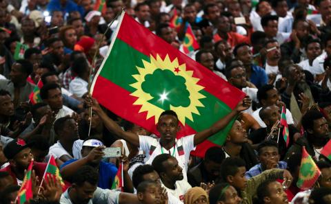 A man holds an Oromo Liberation Front (OLF) flag as people celebrate the returning of Jawar Mohammed, U.S.-based Oromo activist and leader of the Oromo Protests, in Addis Ababa, Ethiopia, August 5, 2018. PHOTO BY REUTERS/Tiksa Negeri