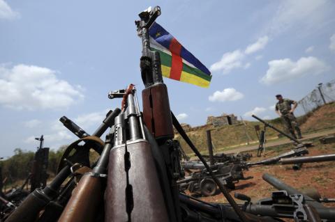 A Central African Republic flag is seen on a gun, which is diplayed among other arms confiscated from ex-Seleka rebels and "anti-balaka" militia by the French military of Operation Sangaris at a French military base in Bangui on February 28, 2014. REUTERS/Sia Kambou/Pool